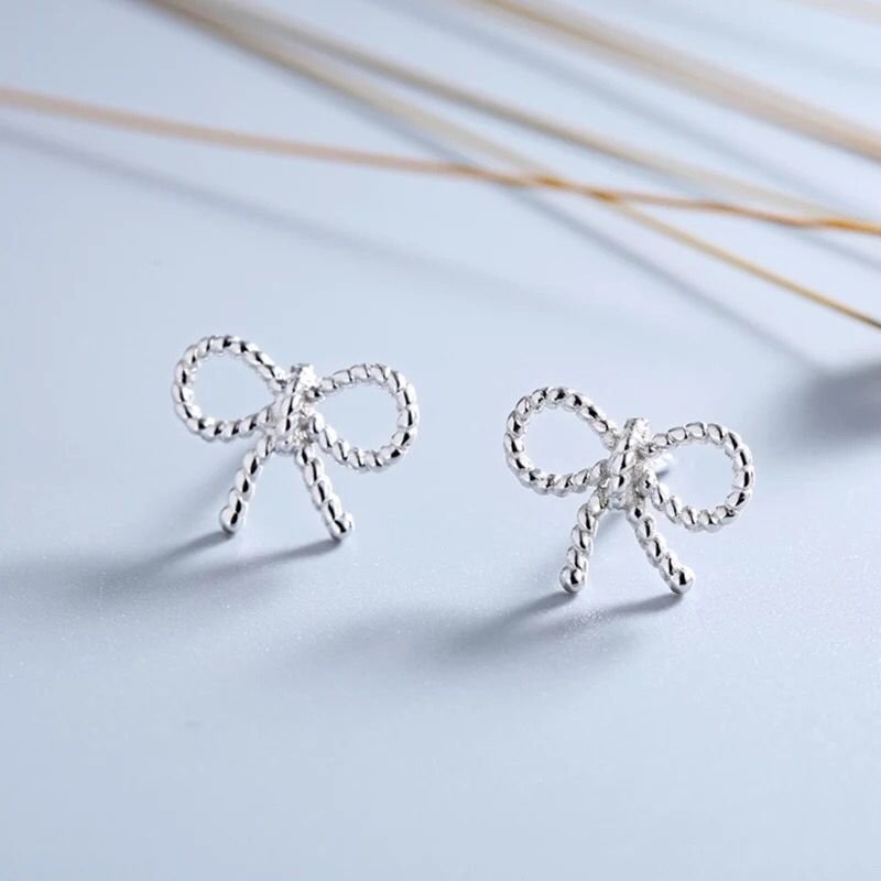 Twisted small bow silver needle earrings Simple sweet beauty raw silver earrings